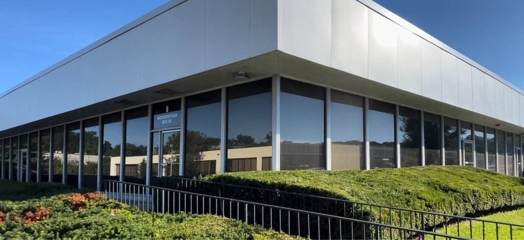 Exterior Of Modern Office Building And Landscaping