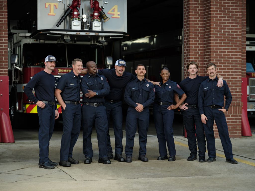 Firefighters Posing In Front Of Engine And Station